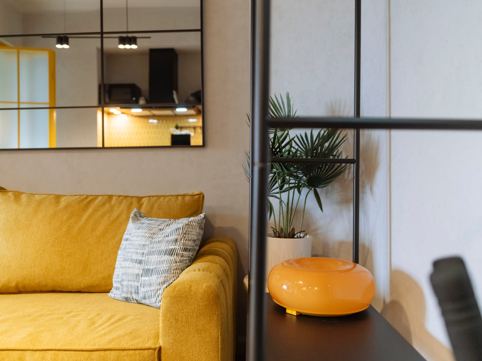 Demeter Studio 87 — Sofa and the orange pouf