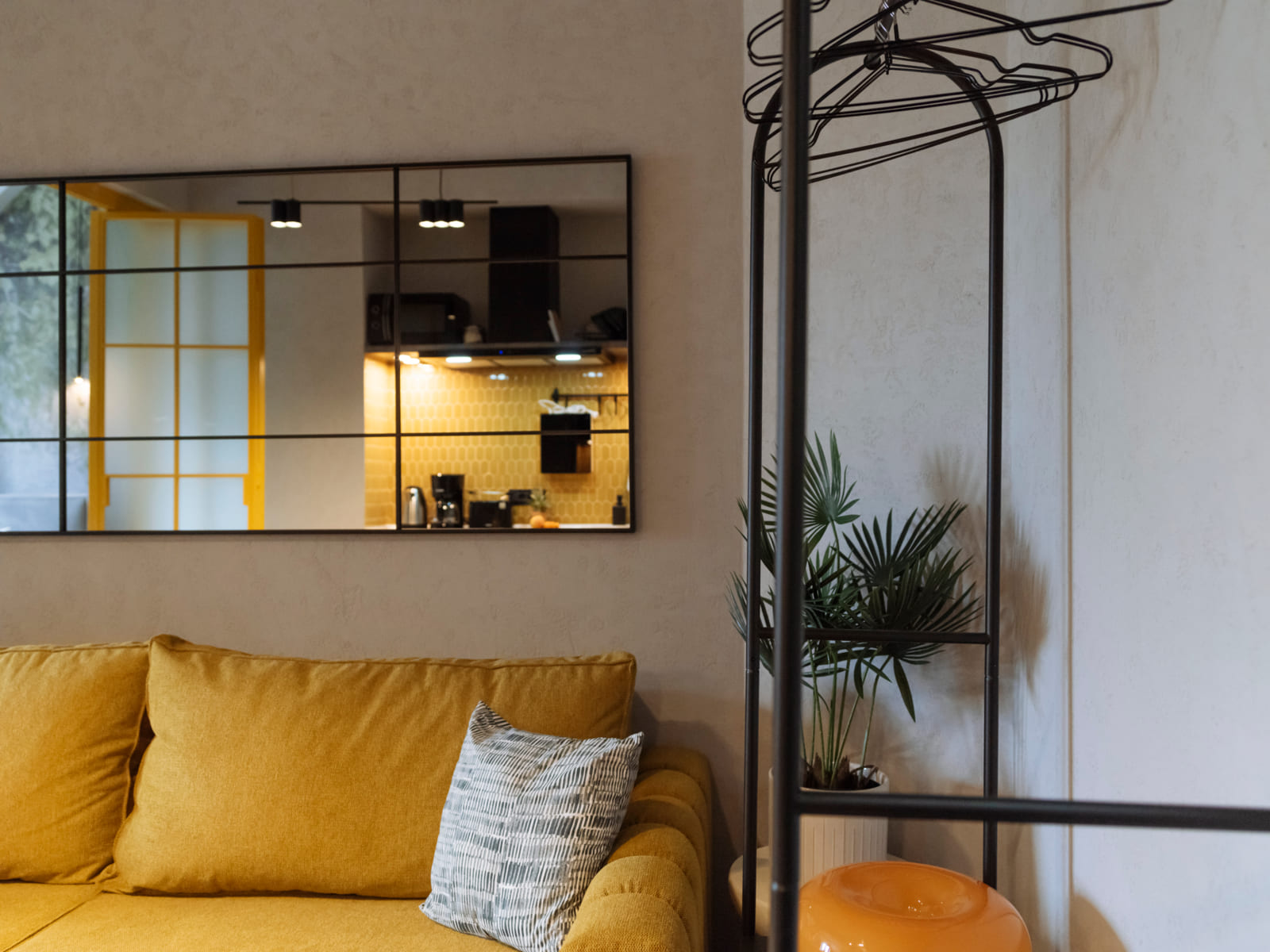 Demeter Studio 87 — Sofa, mirror and palm