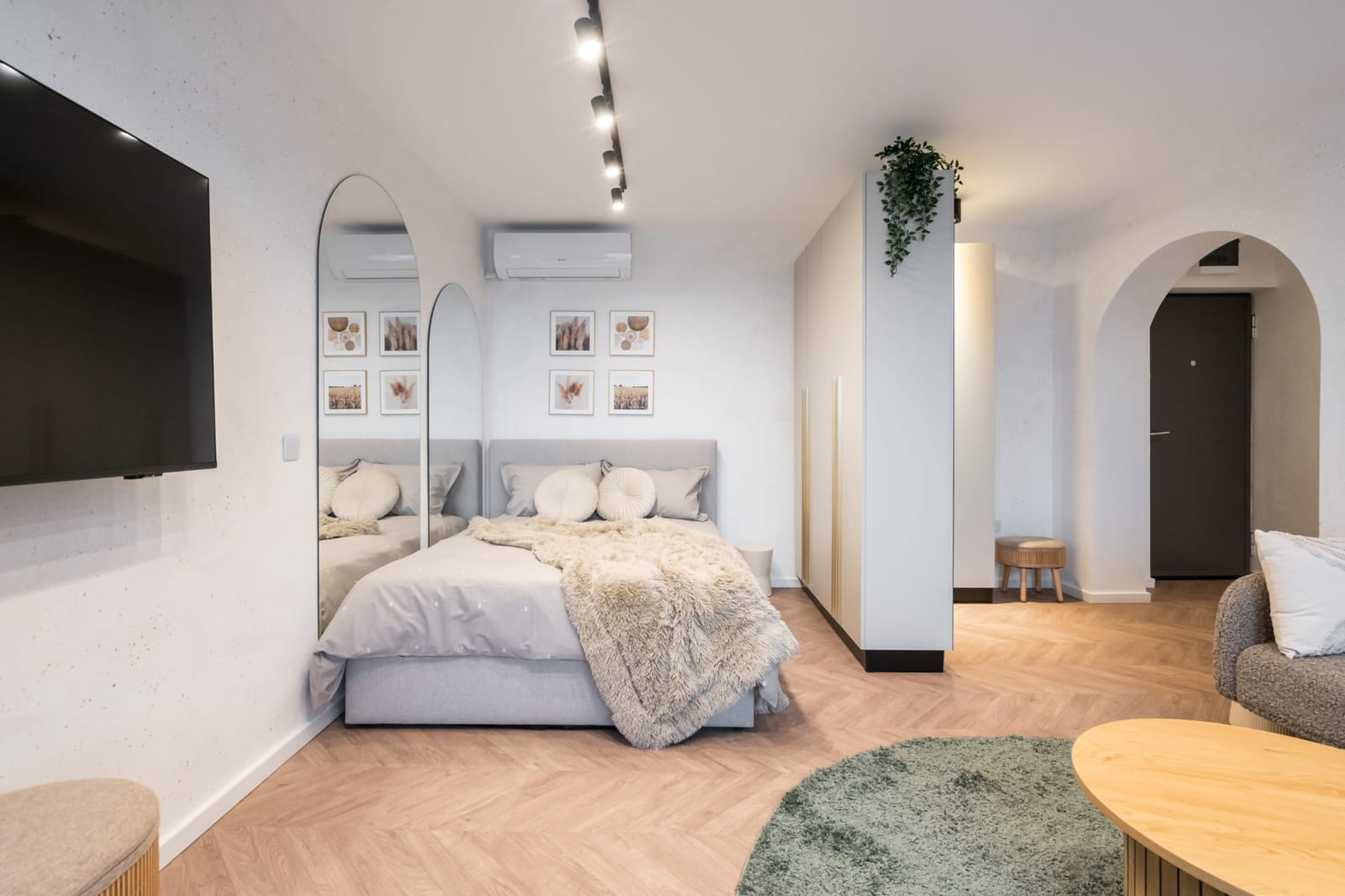P.A.I Apartment — Sleeping area and television wall