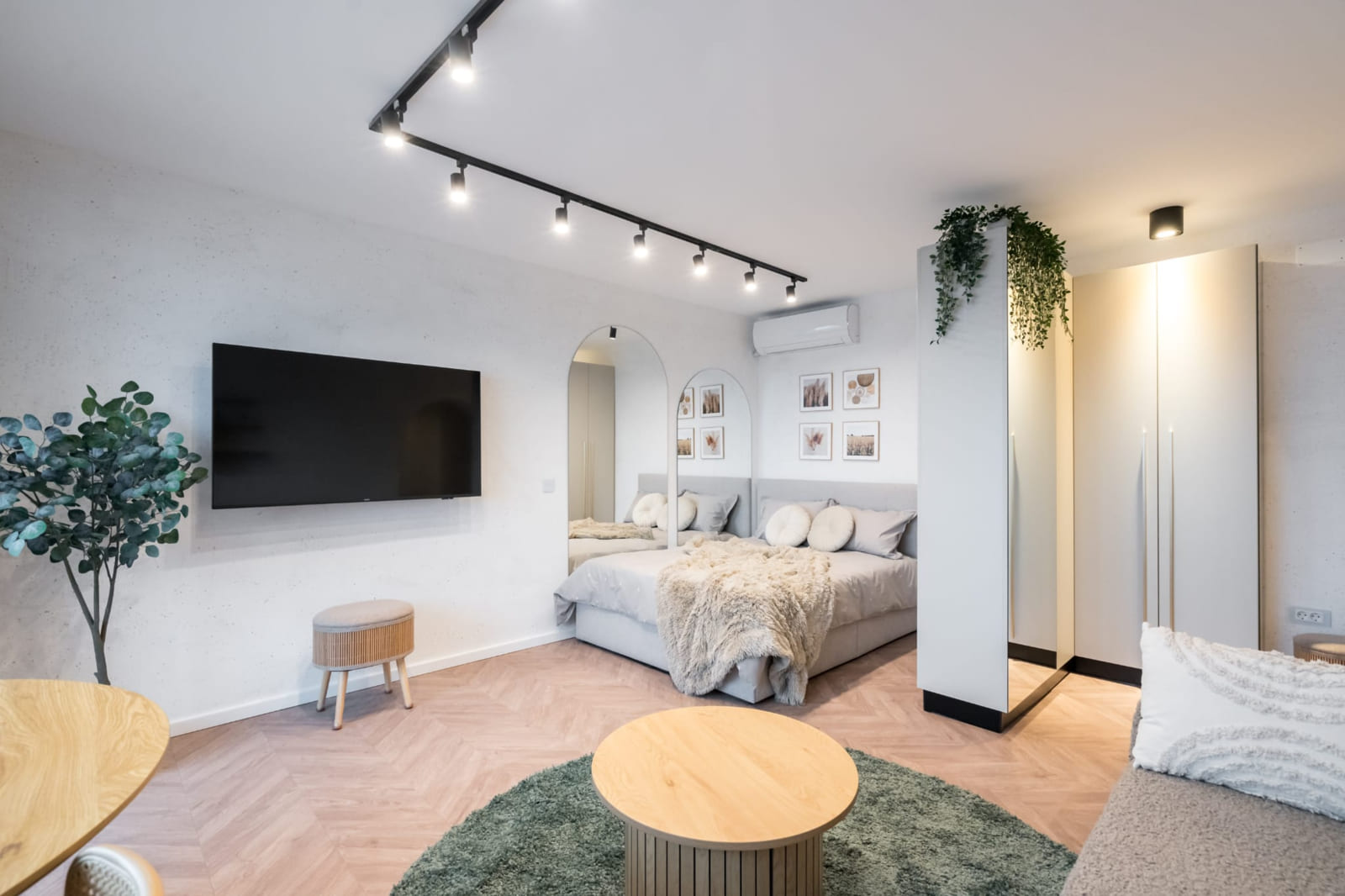P.A.I Apartment — Bed, television and the green rug
