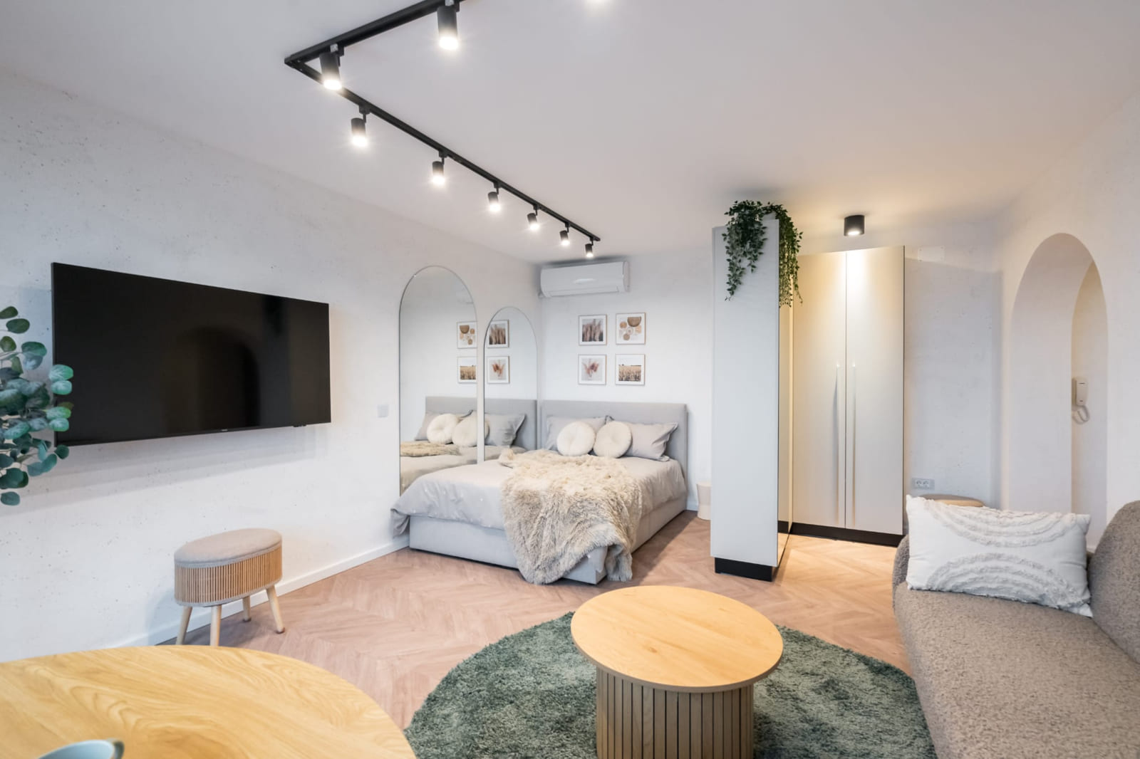 P.A.I Apartment — Bed, arch and table