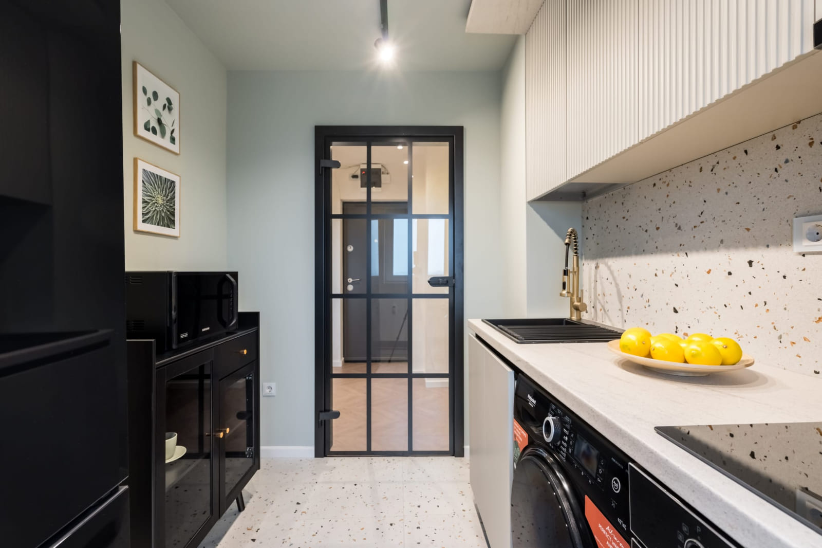 P.A.I Apartment — Kitchen and the steel door