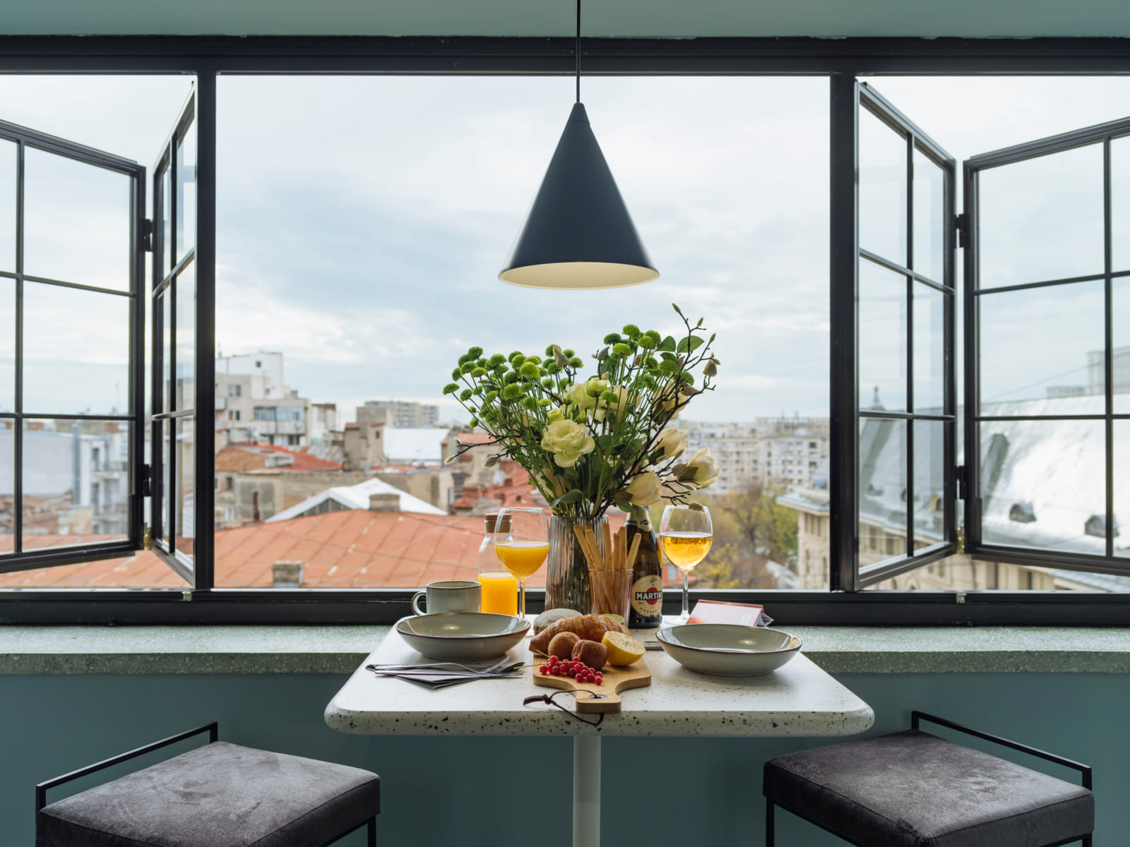 Zalomit Studio 83 — Windows open over the city